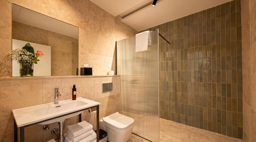 Bathroom walk-in shower with a glass enclosure at St Anne Palace, Floriana, Malta